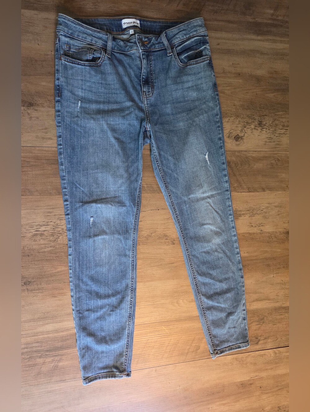 Light Blue Skinny Jeans with Subtle Distressing